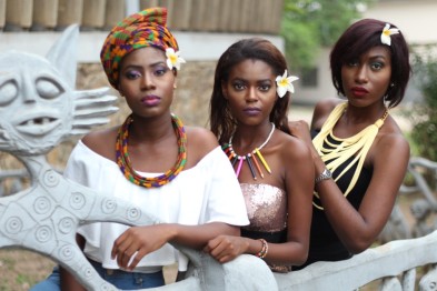 Models modelling African-inspired jewelry and headwrap